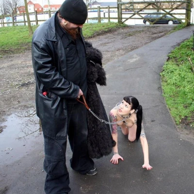 Man carrying pet female slave to his place